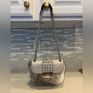 Michael Kors rabbit fur purse. Lightly used.See pictures.Wear on handles.